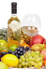 Image showing Still life - bottle of wine, glass and tropical fruit