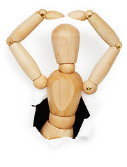 Image showing Wooden man leaned out of hole