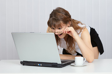Image showing Woman received good news from Internet