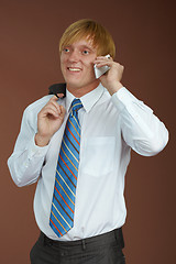 Image showing Young man talking on phone