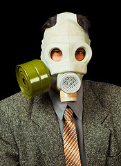 Image showing Portrait of person in a gas mask on black background