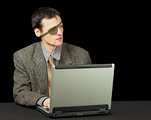 Image showing Man - computer pirate with laptop