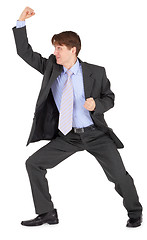 Image showing Young man beats his fist on white background