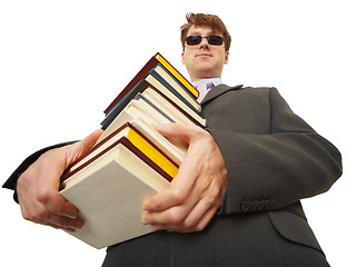 Image showing Self-satisfied person in black glasses with books