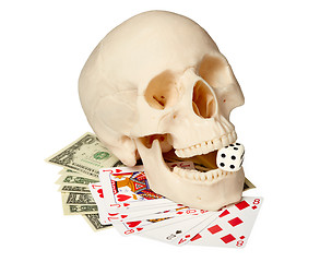 Image showing Human skull, playing cards and money