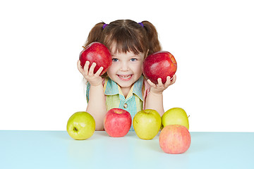 Image showing Funny child playing with two red apples