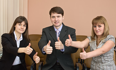 Image showing Team of businessmen show thumb up