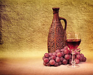 Image showing Artistic arrangement of bottles of wine and grapes