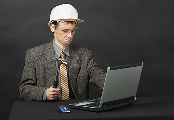 Image showing Man intends independently to repair computer