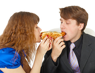 Image showing Man and woman eating sausage