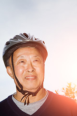 Image showing Senior asian man with bike helmet