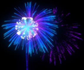 Image showing Festive purple and blue fireworks at night 