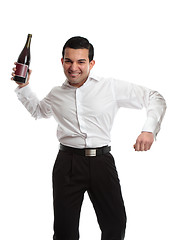 Image showing Party goer with wine bottle celebrating