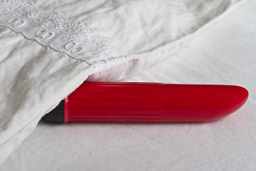 Image showing Red vibrator in bed