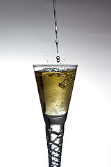 Image showing Champagne pouring into glass