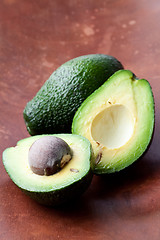 Image showing Avocados on a wooden background