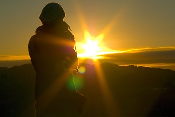 Image showing Person taking pictures of sunset