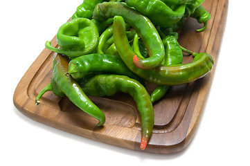 Image showing Hot peppers on kitchen board