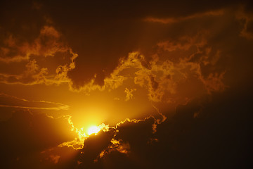 Image showing Bright orange sunset in clouds