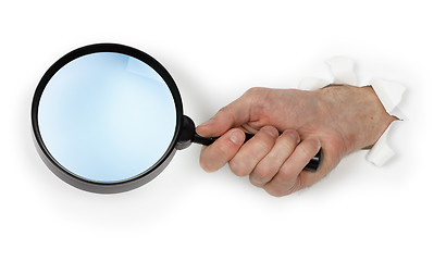 Image showing Magnifying glass in hand