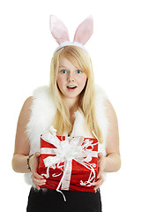 Image showing Happy smiling girl with a gift - rabbit