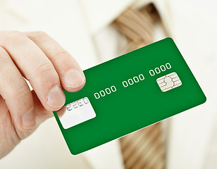 Image showing Green electronic plastic card in hand