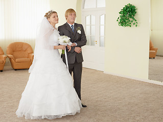 Image showing Groom with bride in ceremonial hall