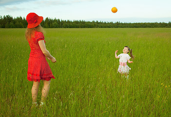 Image showing Mum and daughter play with a ball