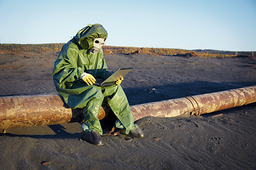 Image showing Environmental scientist in ecological disaster zone