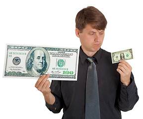 Image showing Businessman feels difference between large and small money
