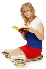 Image showing Young girl - student reads books