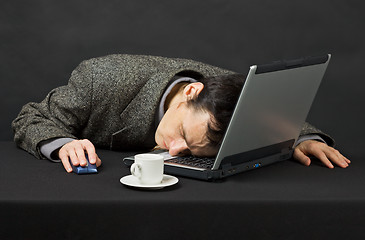 Image showing Guy worked at night in Internet has fallen asleep