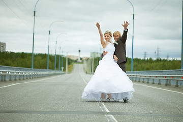 Image showing Newly married have fun on highway