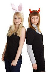 Image showing Two pretty girls in costume rabbit and devil