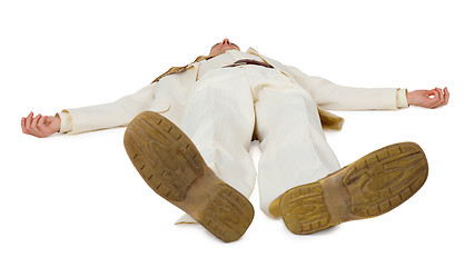 Image showing Man in light suit lying on floor