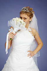 Image showing Young Bride smell the flowers