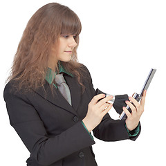 Image showing Woman corrects cosmetics on face