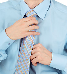 Image showing Business man adjust beautiful new tie