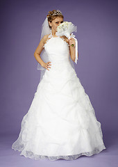 Image showing Bride in white dress with bouquet