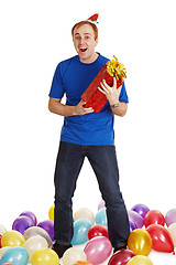 Image showing Cheerful man with New Year's gift in hands