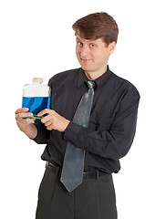 Image showing Cheerful man with vial of a blue liquid