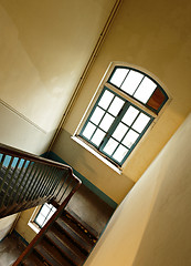 Image showing Looking down at an old wooden stairs at an abandoned building