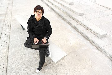 Image showing man using computer outdoor