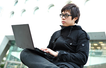 Image showing Man using a laptop outdoors