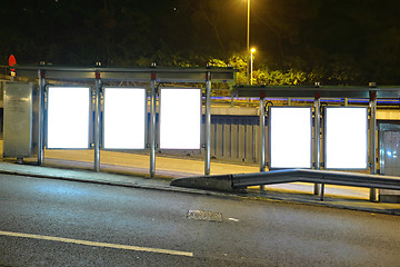 Image showing Blank billboard on bus stop at night