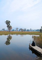 Image showing wetland with lonely girl