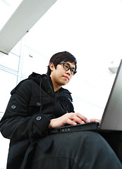 Image showing Man using computer outdoors