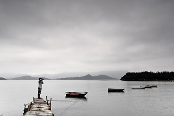 Image showing lonely man taking photo