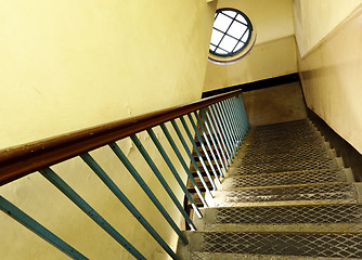 Image showing Looking down at an old wooden stairs at an abandoned building