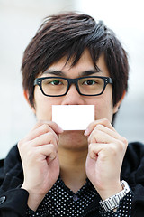 Image showing Blank business card with asian man